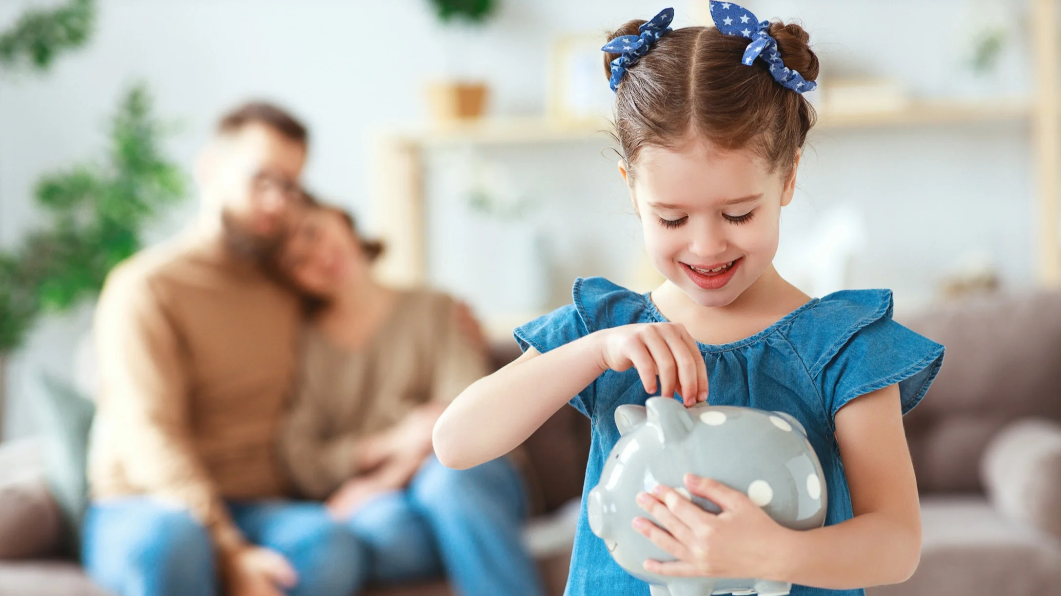 Little girl with piggy bank kids allowance