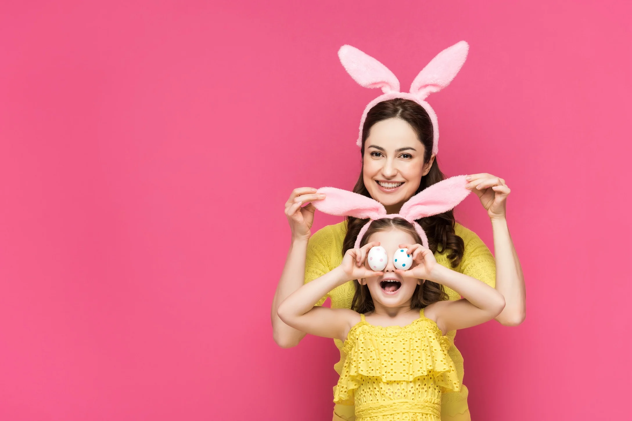 mom and child wearing bunny ears