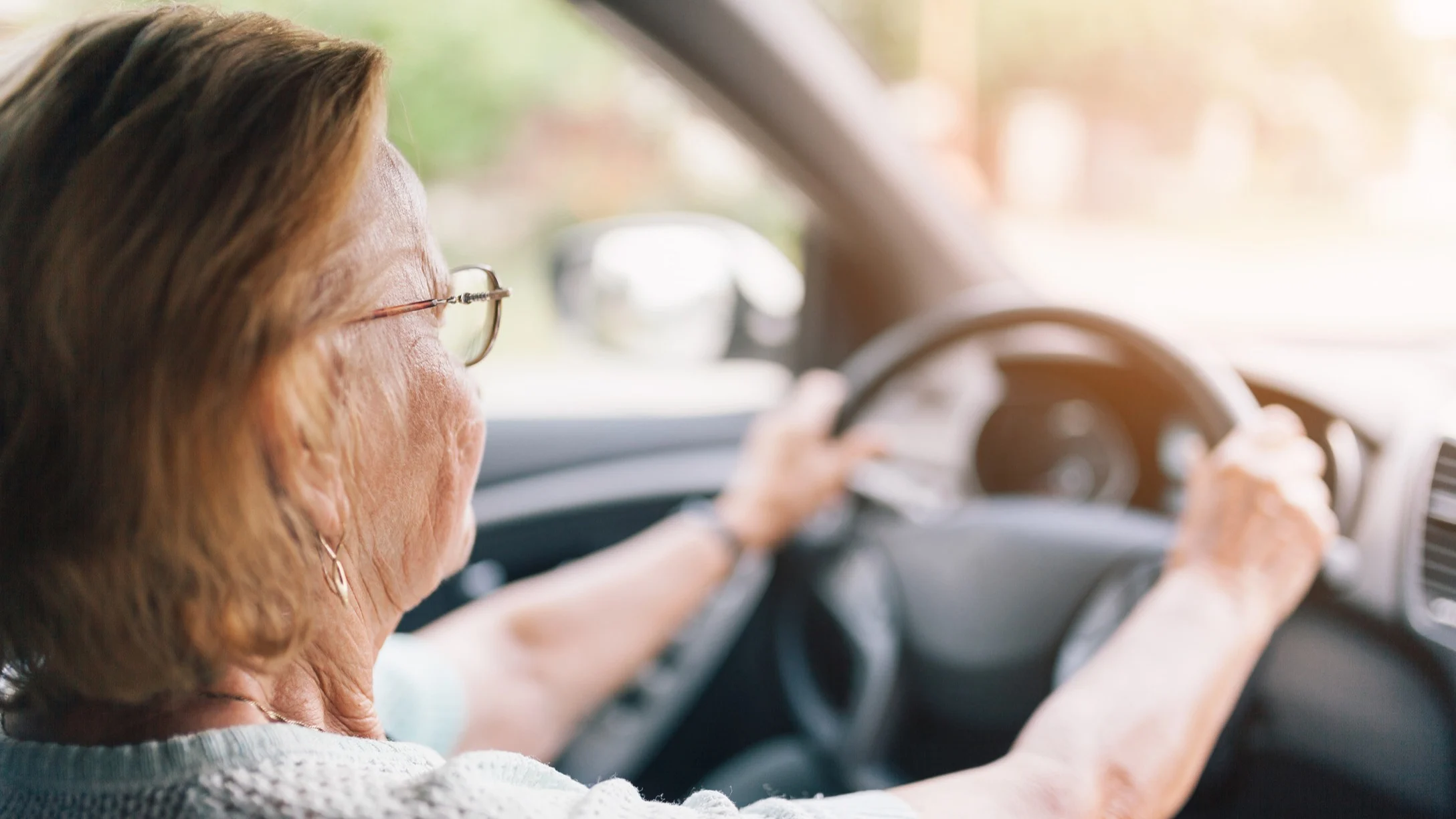 elderly woman driving